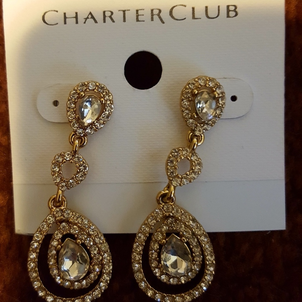 Gold and crystal earrings worn for wedding